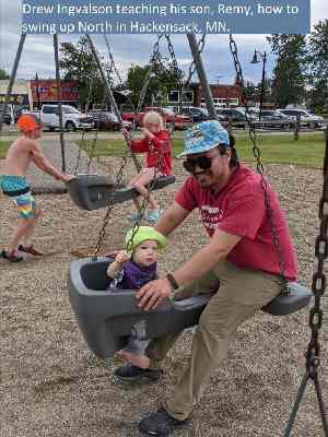 Drew Ingvalson teaching his son, Remy, how to swing up North in Hackensack, MN. (Smaller Sized)