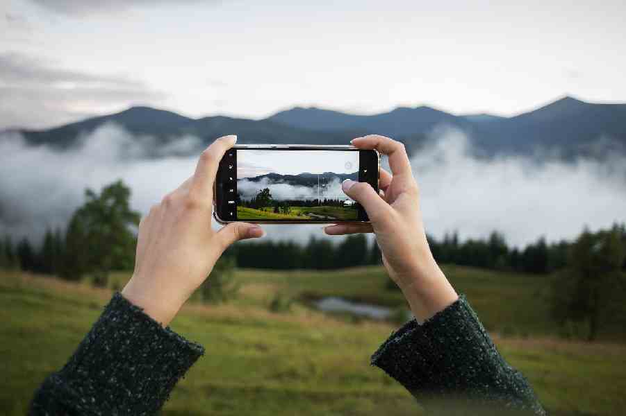 woman-taking-photo-rural-surroundings