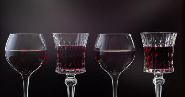 Red wine in different glass shapes